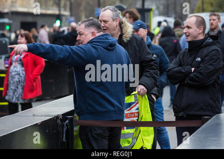 London, UK. 21st January, 2019. Supporters of Yellow Vests UK confront a Remainer (out of picture) outside the Houses of Parliament, Credit: Mark Kerrison/Alamy Live News Stock Photo