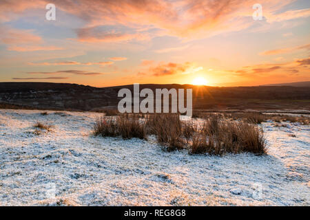 Teesdale, County Durham, UK.  Tuesday 22nd January 2019. UK Weather.  It was a cold, snowy but colourful start to the day as the sun rose over the North Pennines in County Durham. The forecast is for sunny spells and further snow showers, some of which could be heavy. Credit: David Forster/Alamy Live News Stock Photo