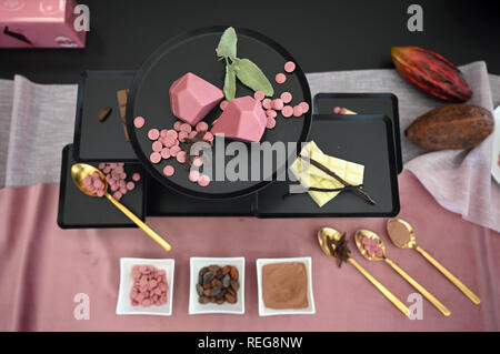 22 January 2019, North Rhine-Westphalia, Köln: Jewels made of Ruby chocolate by Libeert are lying on one table at a press conference for the international confectionery trade fair ISM (27. to 30.1.). Ruby chocolate is made from Ruby cocoa beans without colouring. Photo: Henning Kaiser/dpa Stock Photo