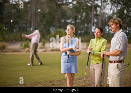 Friends playing golf Stock Photo