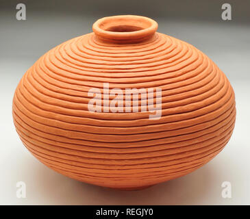 Terracotta coiled ceramic glazed urn Stock Photo