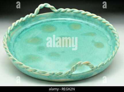 Jade ceramic glazed dish with rope handles Stock Photo