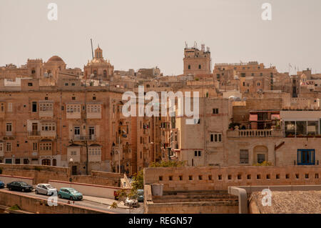 A typical view of old limestone buildings and narrow streets in Valletta, the walled capital of Malta. Seen from Fort St Elmo. Stock Photo