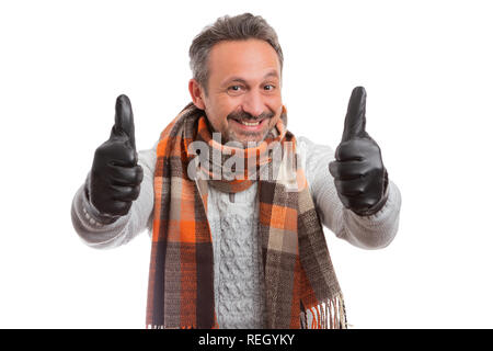 Man smiling showing thumbs-up as like gesture with hands isolated on white studio background Stock Photo