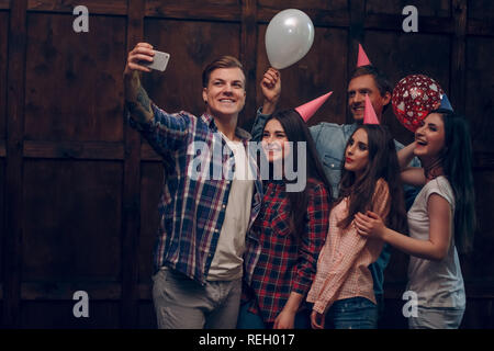 best friends doing selfie in birthday party reh017