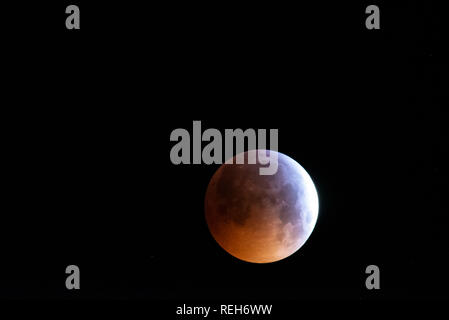 Super Blood Wolf Moon on 21 January 2019. Lunar eclipse. Over Essex, UK. The shadow created by the Earth darkening the moon Stock Photo