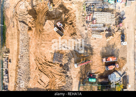 various heavy building machines working at construction site. aerial top view Stock Photo