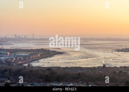 Sunset view from Portsdown Hill at dusk over Paulsgrove Lake and Port Solent and the Spnnaker Tower in the distance, Portsmouth skyline, Hampshire, UK Stock Photo