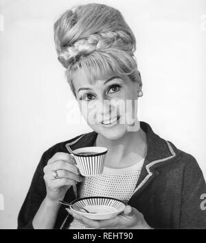 Coffee In The 1960s A Woman Is Drinking Coffee From A Coffeecup