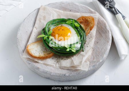 Breakfast with fried egg and green beans Stock Photo