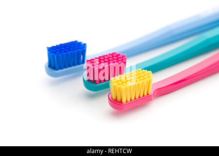 Colorful toothbrushes isolated on white background. Stock Photo