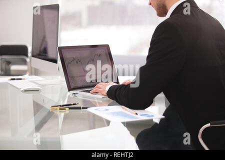 close up hands multitasking man using laptop connecting wifi Stock Photo