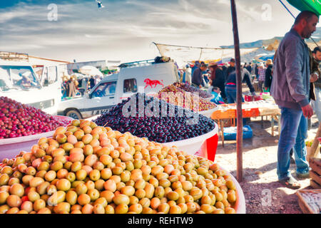 Oued Laou, Chefchaouen, Morocco - November 3, 2018: A stand with many types of olives in the traditional flea market that is held every Saturday Stock Photo