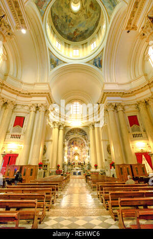 Bologna, Italy - January 12, 2018: central nave interior of Madonna of San Luca Sanctuary with icon of the Madonna with the child in the distance. Vertical shot. Stock Photo