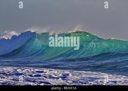 Daunting glimmer and elegant form in Indian Ocean wave along rugged Kalbarri coast in Western Australia Stock Photo