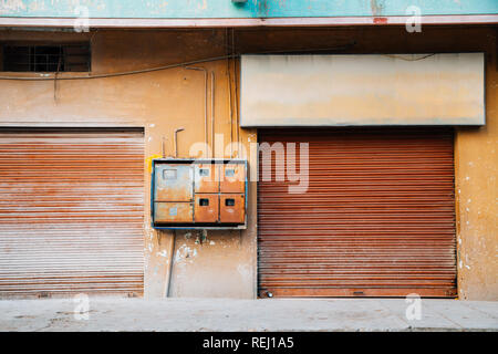 Closed rusty shutter door, old building in India Stock Photo