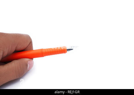 Man hand is holding fountain pen. Isolated on the white background. Stock Photo