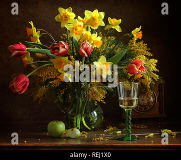 Still life with a bouquet of tulips and daffodils Stock Photo