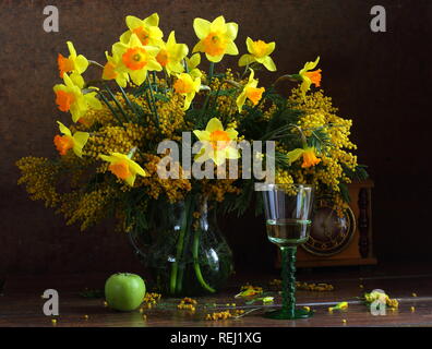 Still life with mimosa and daffodils Stock Photo