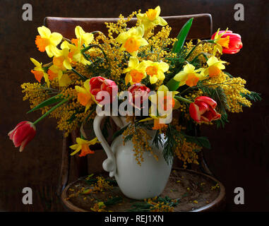 Still life with a bouquet of tulips and daffodils Stock Photo