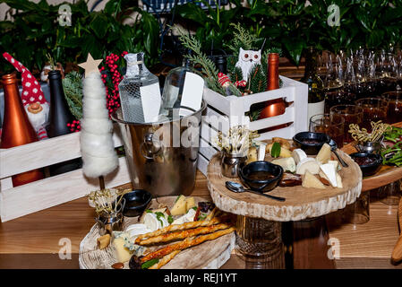 Various snacks and alcohol in glasses on a celebratory table for a buffet table. Stock Photo