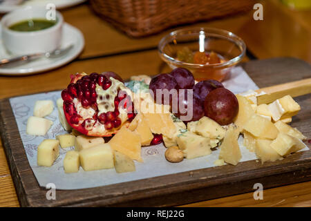 Various dishes and snacks from cheese on the holiday table. Stock Photo