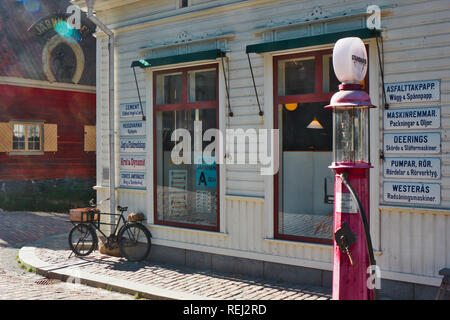 Jarnhandel (Ironmongers store) with old fashioned petrol pump outside, Skansen open-air museum, Djurgarden, Stockholm, Sweden, Scandinavia Stock Photo