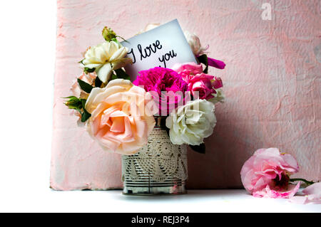Rose flowers bouquet in a vase and I love you message Stock Photo