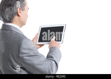 close up.the businessman points to the tablet screen.rear view.isolated on white background Stock Photo