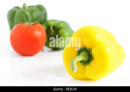 Fresh peppers and tomatoe, isolated on white Stock Photo