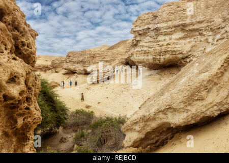 NAMIBE/ANGOLA - 03NOV2018 - Tourists walking in the canyons of the Namibe Desert. Africa. Angola. Stock Photo