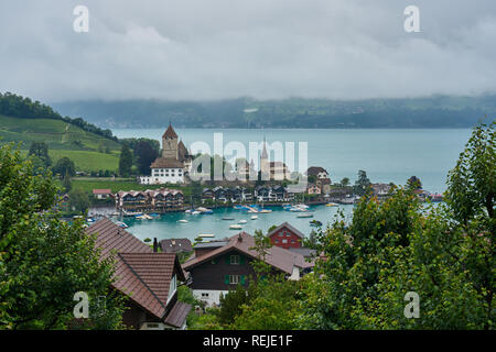 Panorama of Spiez with castle and Schlosskirche on bank of Thun lake, Switzerland Stock Photo