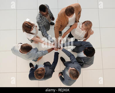 top view.the business team shows its unity Stock Photo