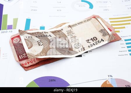 Photo of Indian currency on the financial paper. Stock Photo