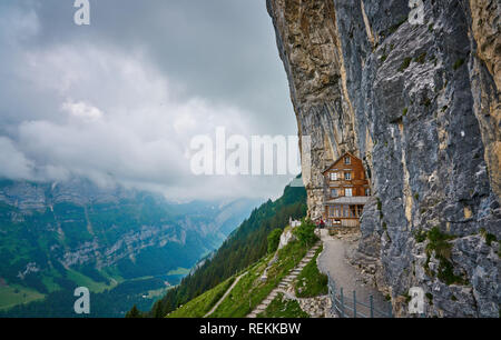 Wooden house on rock. Berggasthaus Aescher-Wildkirchli, Ebenalp, Appenzell,  Switzerland Stock Photo