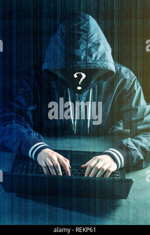 Anonymous hacker programmer uses a laptop to hack the system. Stealing personal data. Creation and infection of malicious virus. The concept of cyber  Stock Photo