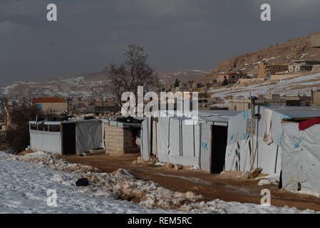 Refugee camps in Arsal, Lebanon's Bekaa Valley hit by winter storms. More than 22,000 Syrian refugees living in 574 settlement structures across Lebanon have been affected by this year's winter storm, according to UN figure Stock Photo
