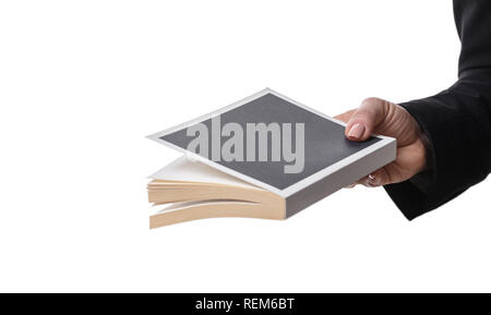 female hand holding book on white isolated background Stock Photo