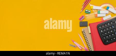 Advertising concept. Panoramas for use as media have free space to enter text. Stationery and notebooks are placed on a yellow back. Pencil, compass,  Stock Photo