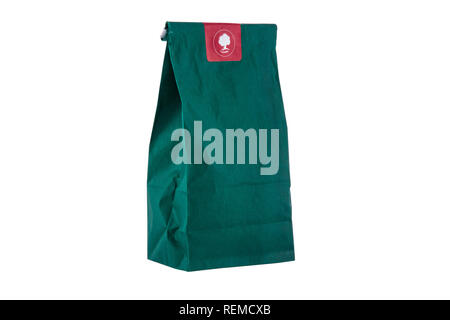 Paper package or small bag with herbs isolated on a white background Stock Photo