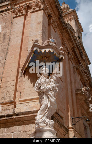 Details and statue on the corner of the baroque Annunciation Church in Mdina, Malta. Stock Photo