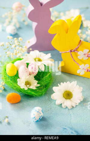 Happy Easter Card. Congratulatory easter background. Easter eggs, Easter eggs cute bunny and flowers. Stock Photo