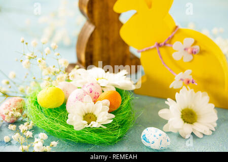 Happy Easter Card. Congratulatory easter background. Easter eggs, Easter eggs cute bunny and flowers. Stock Photo