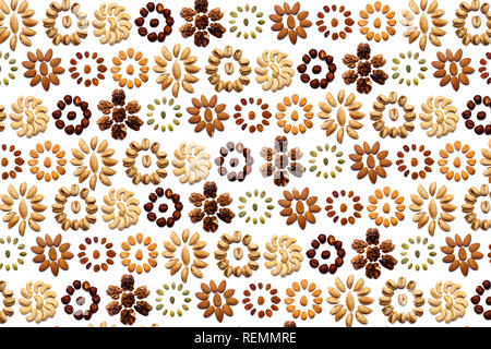 A collection of nuts made from almonds, walnuts, hazelnuts, pistachios, cashews lie in the shape of a circle or the sun on an isolated white backgroun Stock Photo