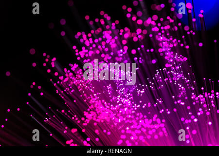 Abstract high-tech background of glowing fiber optic cable Stock Photo