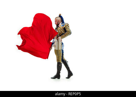 Torero in blue and gold suit or typical spanish bullfighter isolated over white studio background. The taming, achieving the goal, mortification, conquest, boss, leadership, battle, win, winner concept Stock Photo