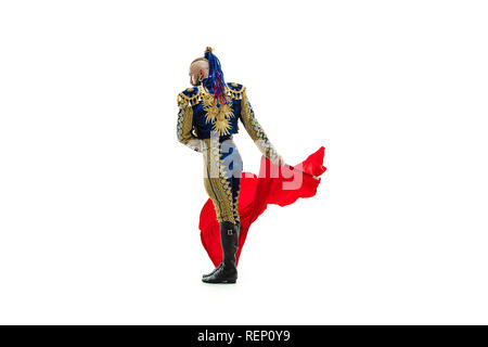 Torero in blue and gold suit or typical spanish bullfighter isolated over white studio background. The taming, achieving the goal, mortification, conquest, boss, leadership, battle, win, winner concept Stock Photo