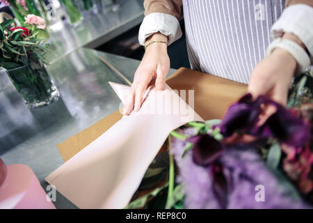 Professional designer working with plants in floral studio Stock Photo