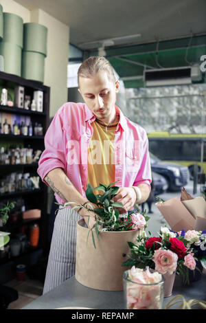 Professional designer working in floral studio alone Stock Photo