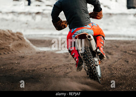 racer enduro motorcycle riding on winter track Stock Photo